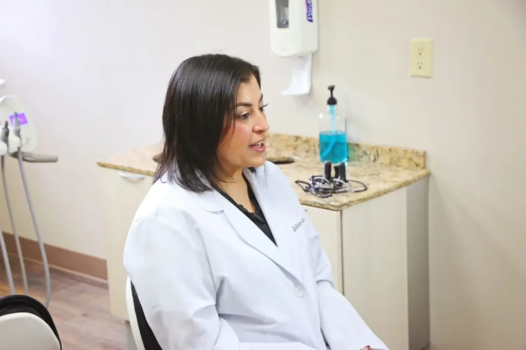 Dr. Mariam Hanna, DDS talking with a patient at Diamond Dental in Tulsa